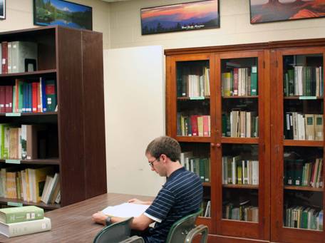 Student reading in library